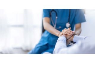 Cropped shot of a female nurse hold her senior patient's hand.