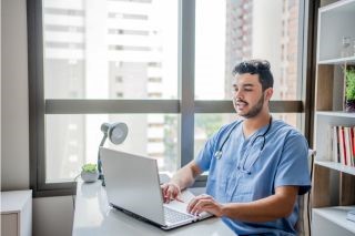 Male nurse on telemedicine in his office